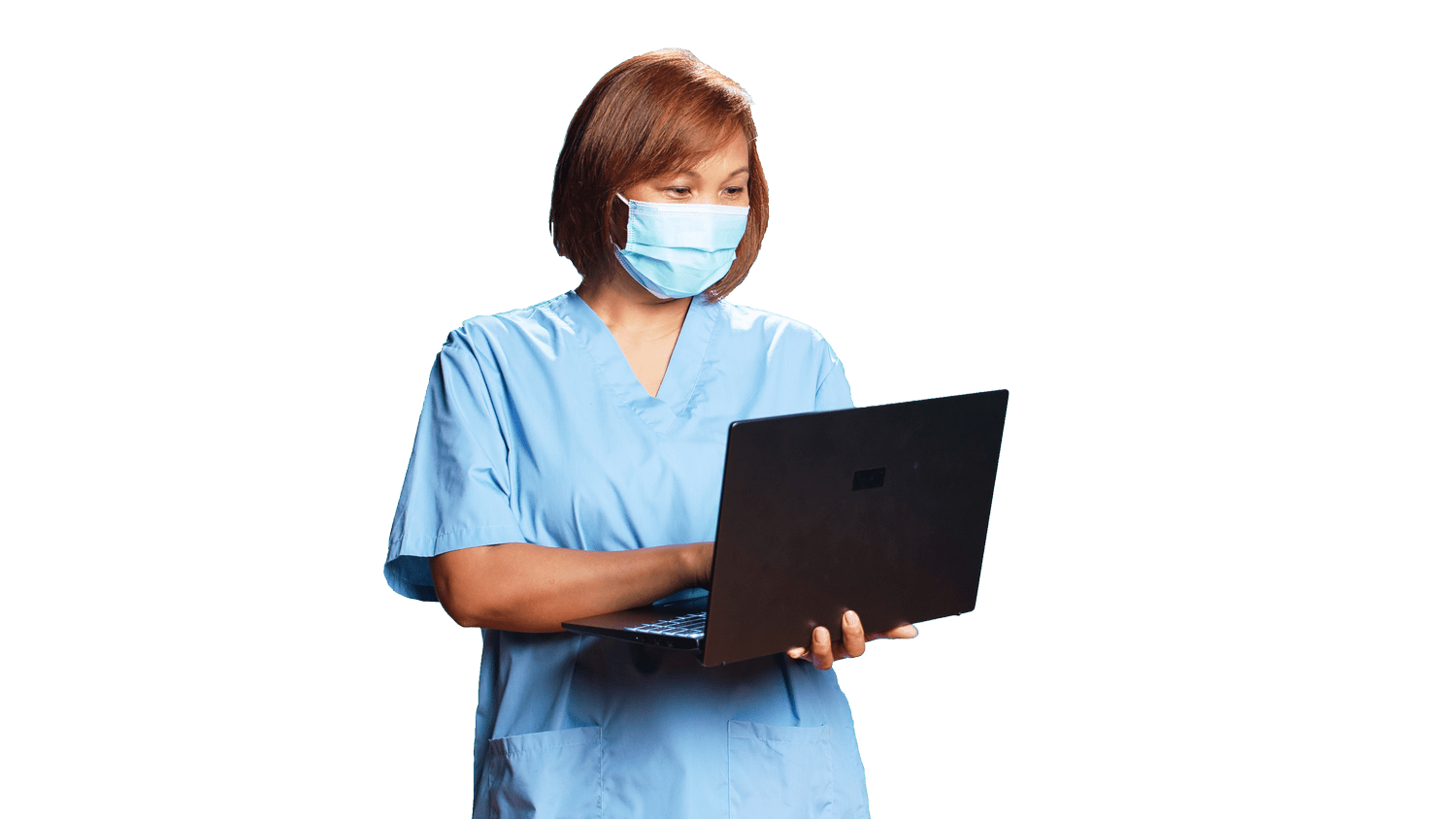 A nurse chatting with a patient while using a laptop
